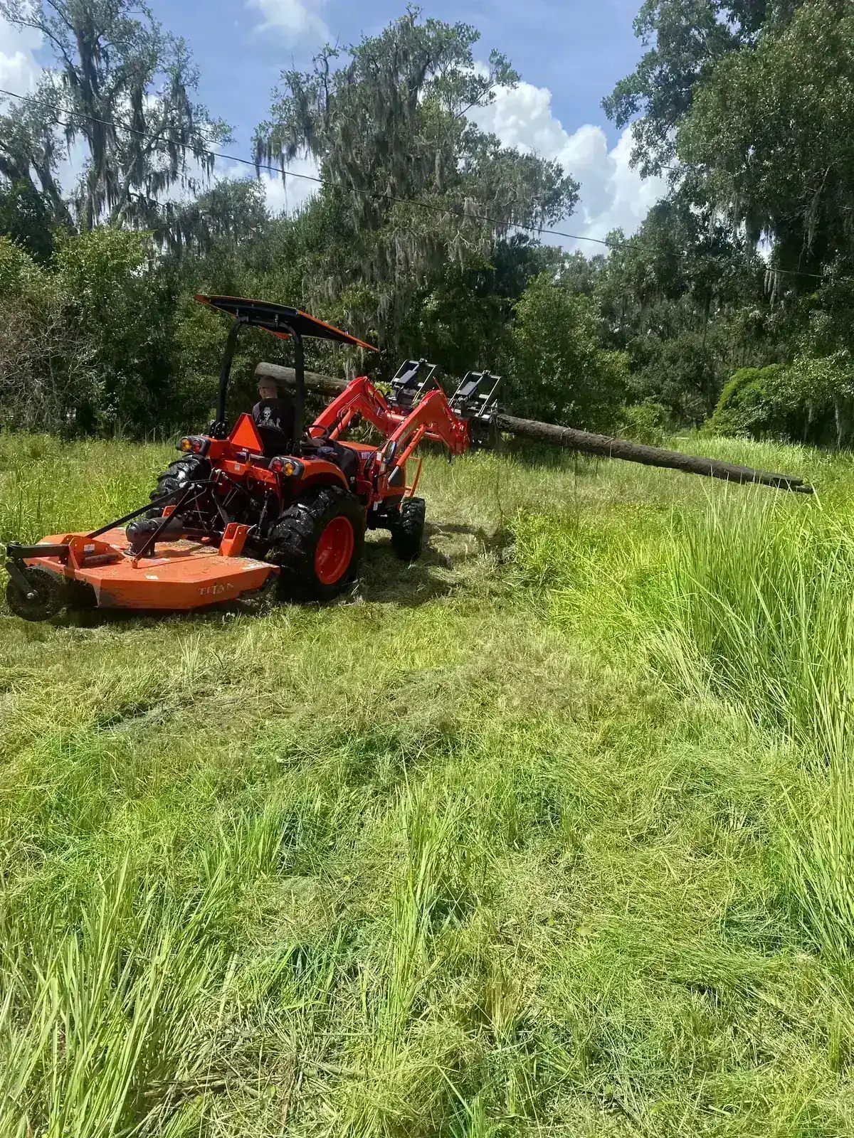Faith Works tractor with grapple